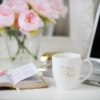 A coffee mug sitting on top of a table.