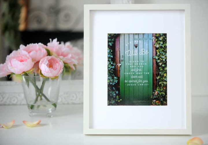 A picture frame with a green door on it