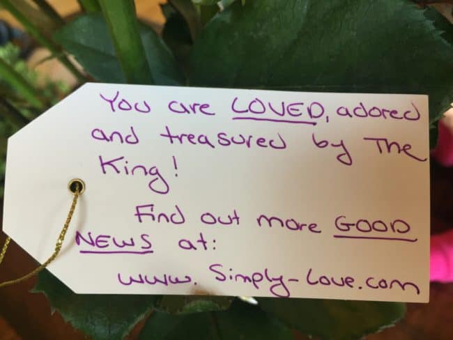 A note on a tag that says you are loved, adored and treasured by the king.